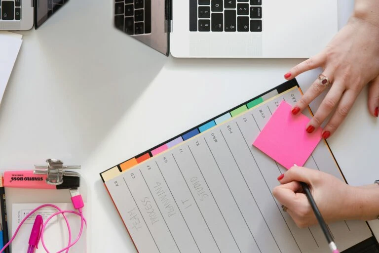 Planner on desktop. Photo by Marten Bjork on Unsplash